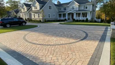 Completed interlocking paver driveway installation by Chop Chop Landscaping in Minneapolis, MN
