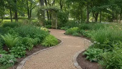 Pea gravel garden path in Minneapolis MN showcasing professional landscaping and natural drainage design